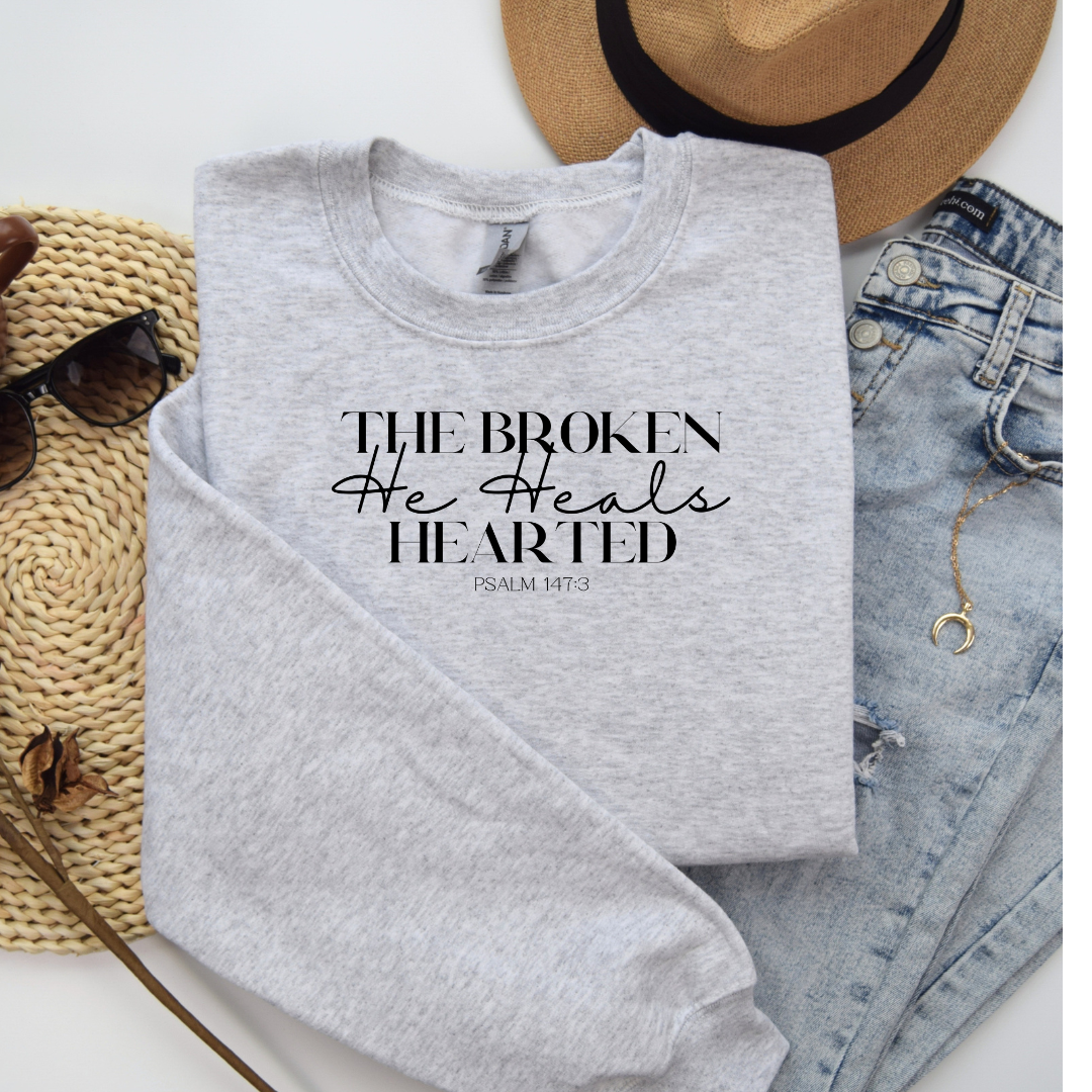 The Broken He heals Hearted Unisex Heavy Blend Crewneck Sweatshirt